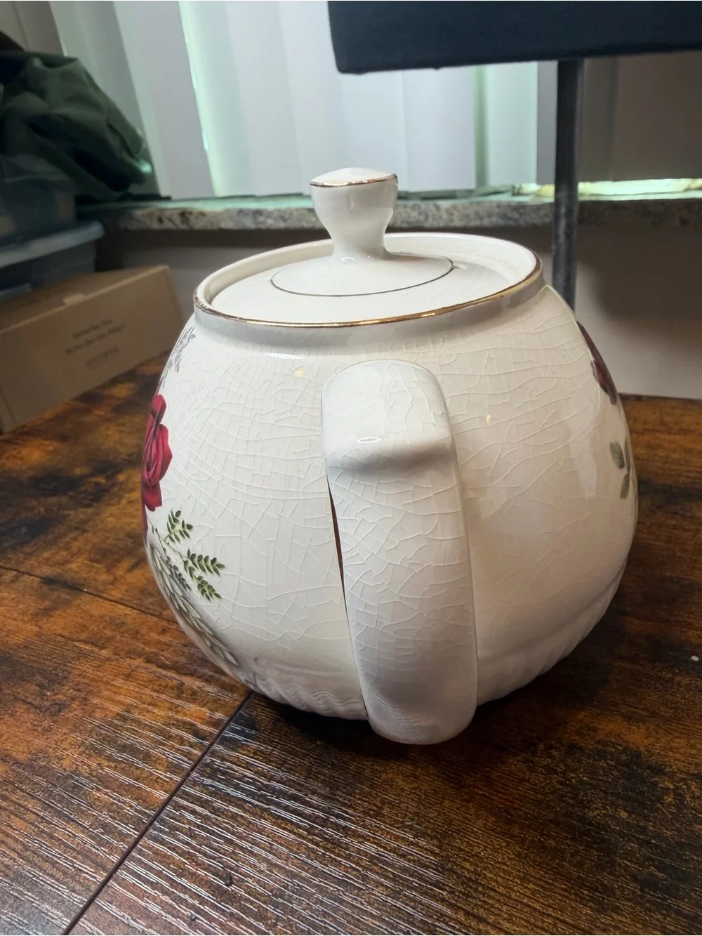 Vintage Ellgreave England red rose teapot featuring delicate gold trim.